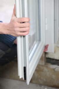 Man installing double glazed windows